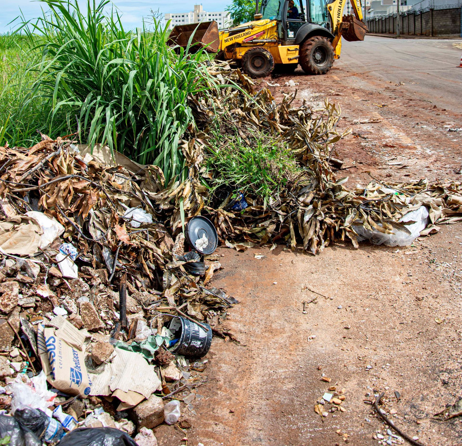 A bulldozer cleaning up urban waste in Londrina, Brazil.